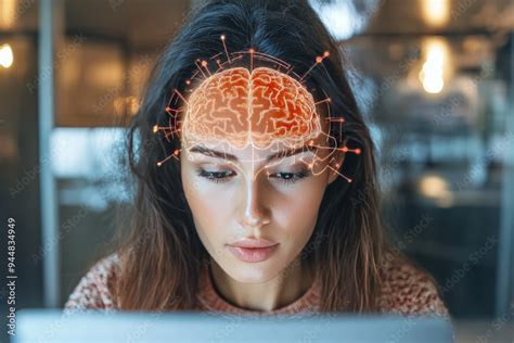 Focused Woman Wearing Brain Monitoring Electrodes While Working On A