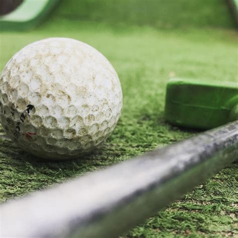 Premium Photo Close Up Of Golf Ball And Club On Grass