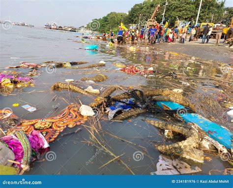 After Immersion Of Idols In The Holy River Ganges , Corporation Workers Manually Collecting Hard ...