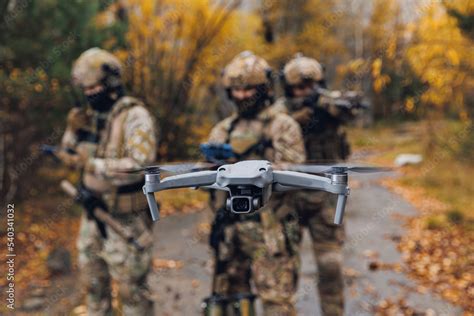 Modern Army Soldiers Using Aerial Drone For Artillery Guidance And