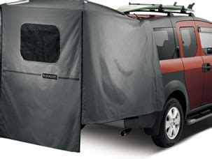 An Suv With A Tent Attached To It