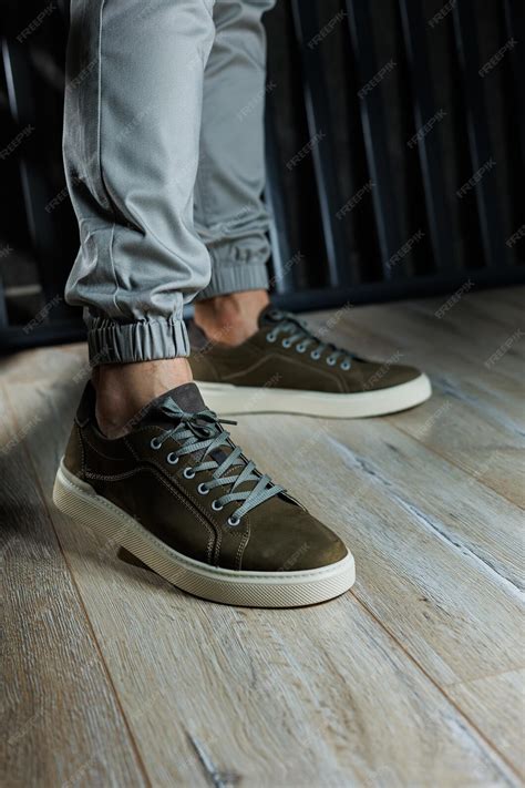 Premium Photo Closeup Of Male Feet In Green Leather Shoes A Young Man Is Standing In Leather