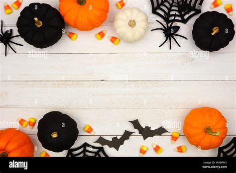 Halloween double border with black, orange and white decor and candy ...