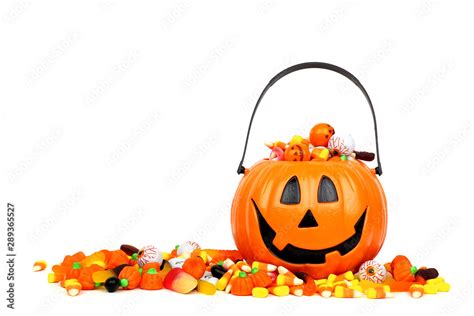 Halloween Jack O Lantern Bucket Overflowing With Candy Side View Isolated On A White Background