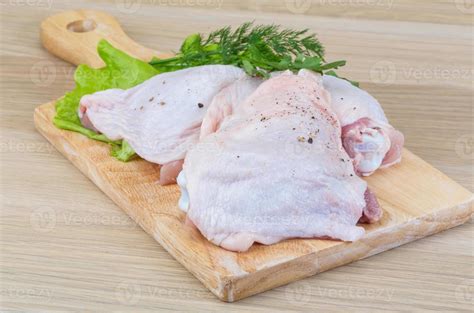 Raw chicken thighs 8410590 Stock Photo at Vecteezy