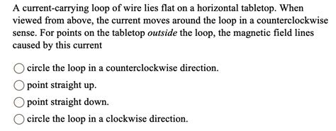 Solved A Current Carrying Loop Of Wire Lies Flat On A Horizontal