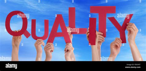 Many People Hands Holding Red Word Quality Blue Sky Stock Photo Alamy