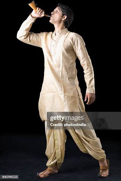 wearing dhoti   premium high res pictures getty images