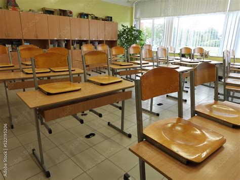 Empty school classroom with desks Stock Photo | Adobe Stock