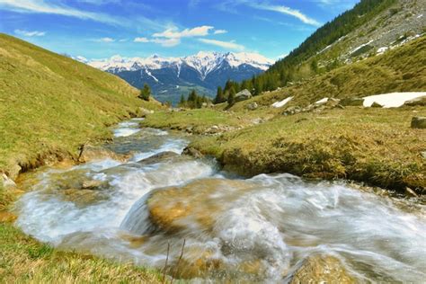 Premium Photo Water Of An Alpine Stream Flowing In Mountain And Snowy