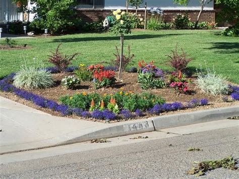 Full And Overflowing Corner Flower Beds For Your Lawn