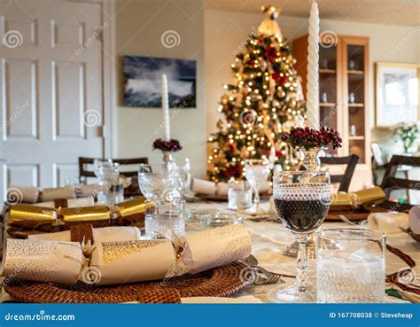 Traditional Family Christmas Lunch Table Set with Crackers with Tree in ...