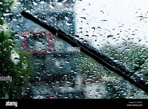 Raindrops And Wiper On Car Windshield Use Wipers And Drive Slowly In