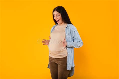 Pregnancy Advertisement Excited Pregnant Woman Pointing Aside At Copy