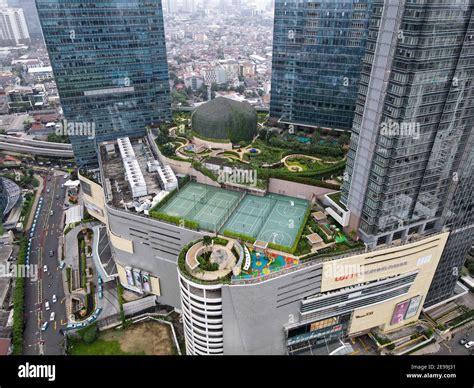 Aerial view of Lotte Shopping Avenue building in Jakarta and noise cloud with cityscape. the ...