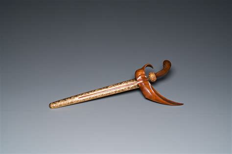 An Indonesian Kris Or Keris Dagger In Polished Javanese Wood With