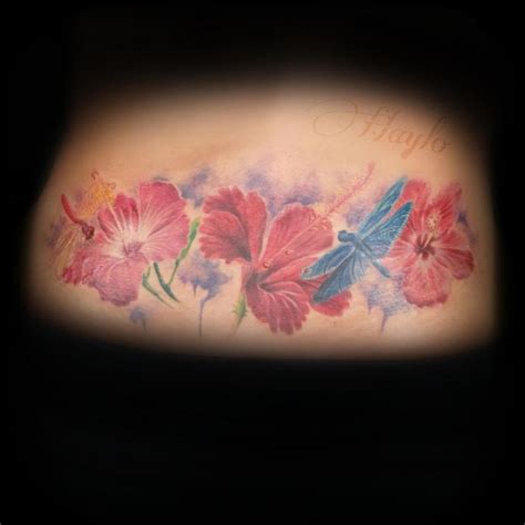 Lower Back Custom Realistic Style Tattoo With Hibiscus Flowers And