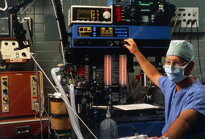 Anaesthetist adjust anaesthetic equipment - Stock Image - M554/0176 ...