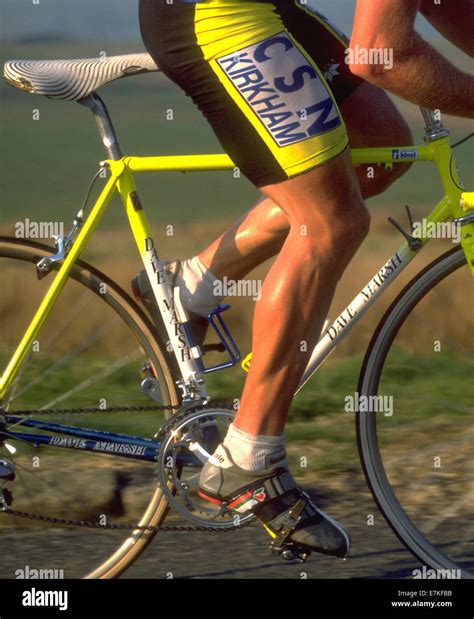 Cyclist legs turning the gears around Stock Photo - Alamy