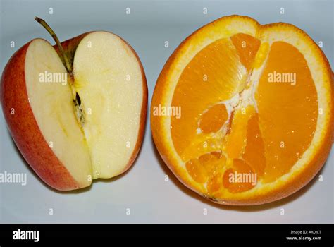 Comparing apple to orange Stock Photo - Alamy