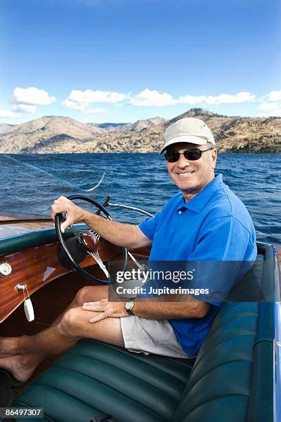 Man Driving Boat Lake Photos And Premium High Res Pictures Getty Images