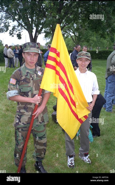 Soldier age 19 with South Vietnam flag at the Vietnam memorial. St Paul Minnesota USA Stock ...