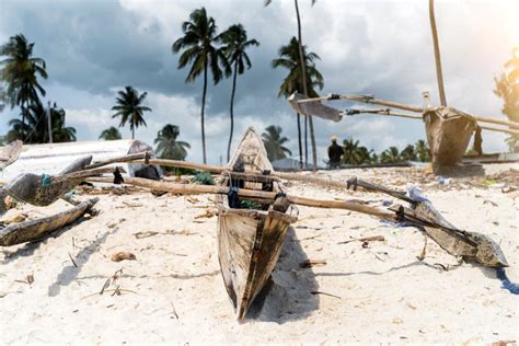 Old Wooden Fishing Boats With Paddles On A Beach Stock Photo Image Of