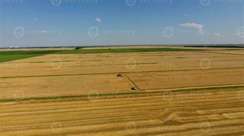 Harvesting barley harvesters. Fields of wheat and barley, the work of ...