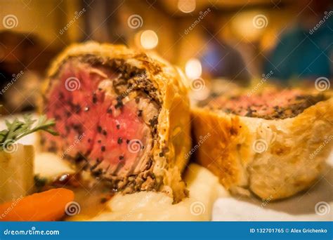 Slice of Beef Wellington with Spinach and Carrots Stock Image - Image ...