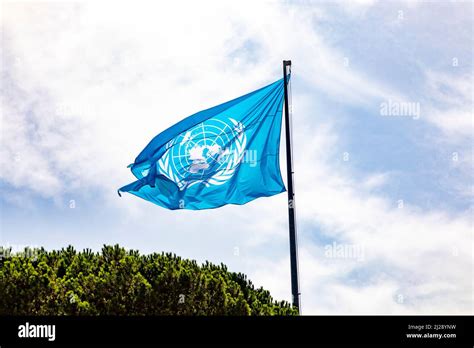 Rome, Italy - August 1, 2021: Flag of United Nations against blue sky ...