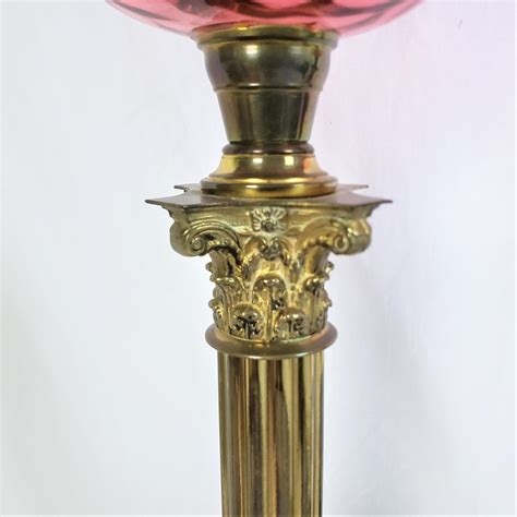 Pair Of Antique Cranberry And Brass Corinthian Column Banquet Or Parlor