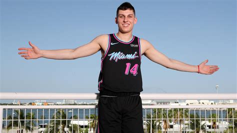 Smiley Cute Tyler Herro Is Showing Hands In The Air Wearing Black Dress