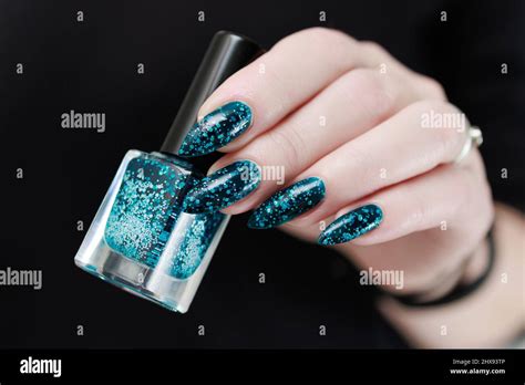 Woman S Beautiful Hand With Long Nails And Teal Green And Blue Manicure