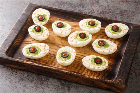 Monster Eyes Deviled Eggs With A Avocado And Olives For Halloween Day