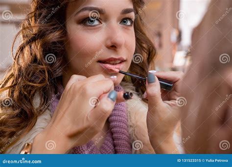 Makeup Artist Applies Red Lipstick Beautiful Woman Face Hand Of Make