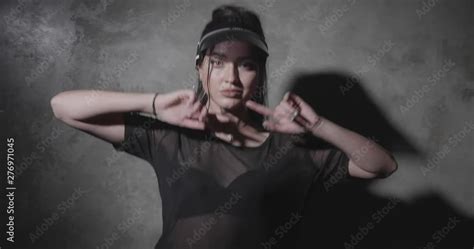 Sensual Woman Wearing Black See Through T Shirt Lingerie And Sun Visor