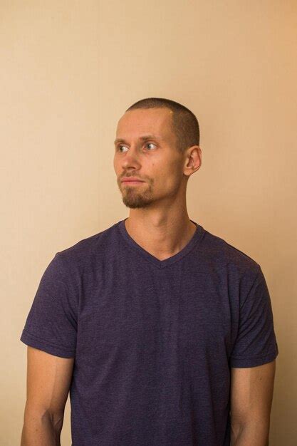 Premium Photo Portrait Of Mid Adult Man Standing Against Wall