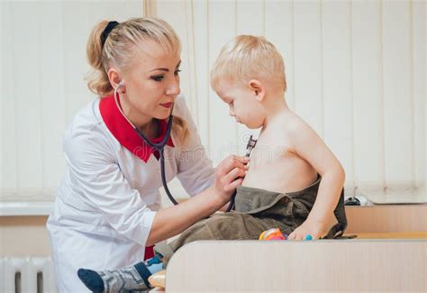 Doctor Woman Examining Heartbeat of Child with Stethoscope Stock Photo ...