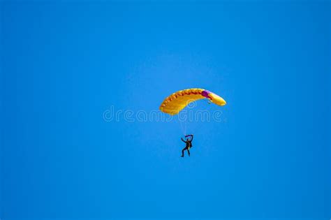 Parachute In The Sky Skydiver Is Flying A Parachute In The Blue Sky