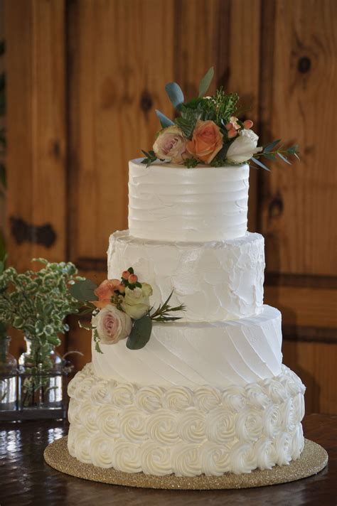 Tiered White Wedding Cake With Rosette And Textured Spackle Design