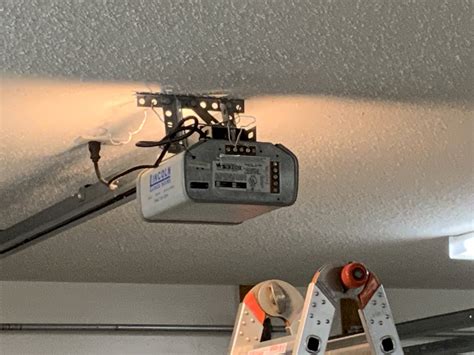 garage door opener - How do I remove the cover on Chamberlain 9300