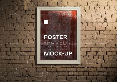 Realistic Framed Poster Holding Mock Up By Xepeec GraphicRiver