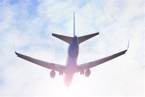 Plane Flying through Clouds in the Sky. Jet Aircraft. Stock Image - Image of flying, plane: 88058111