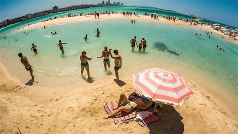 Premium Photo Aerial View Of Sandy Beach With Tourists Swimming