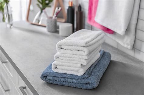 Premium Photo Stack Of Clean Towels On Table