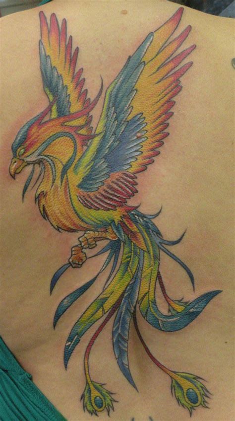 A colorful rainbow phoenix tattoo. The combination of colors symbolizes ...