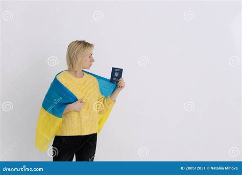 Ukrainian Girl With The Flag Of Ukraine And A Passport A Girl Holds A