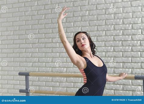 Ballerina Stretches Herself Near Barre In The Classroom Beautiful