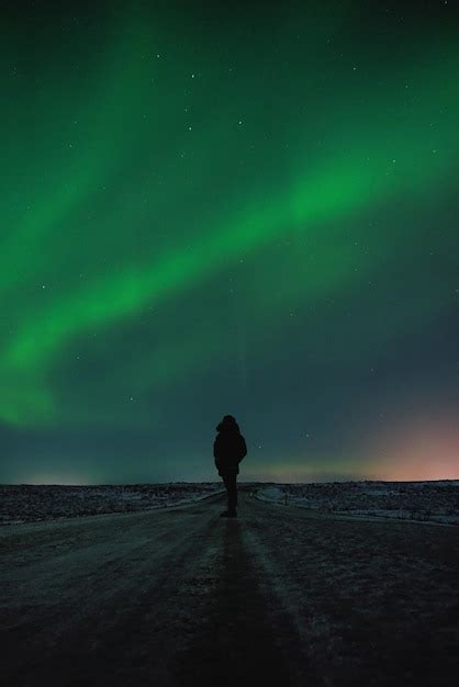 Premium Photo Silhouette Man Walking On Road Against Sky With