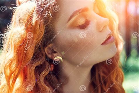 Beautiful Redhead Norwegian Girl With Big Eyes And Freckles On Face In The Forest Portrait Of